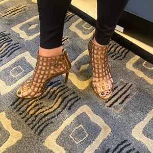 Dark gold lattice design high heel ankle boots with back zipper.